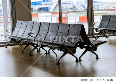 Empty airport departure lounge terminal waiting area with chairs 89341636