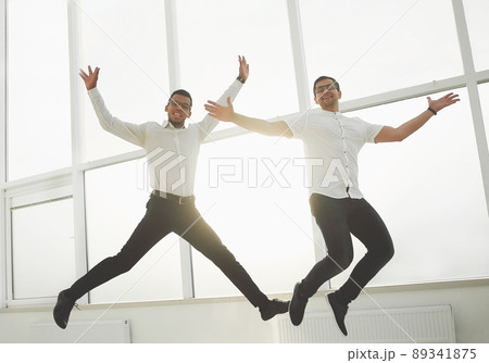 two happy business colleagues showing their success 89341875