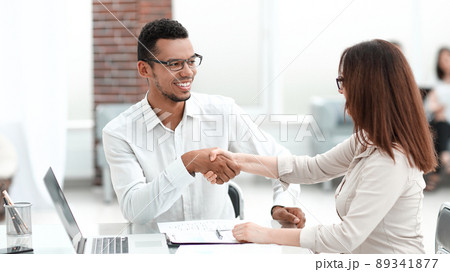 businessman and businesswoman making a deal in a modern office 89341877