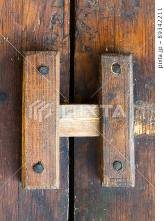 Closeup of a wooden aged latch Closeup of a wooden aged latch 89342211