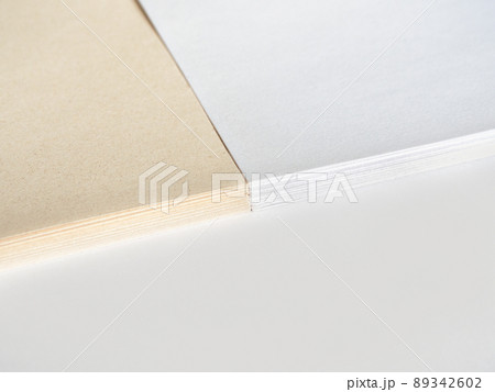 Paper without bleaching in comparison with ordinary white of high quality. White recycled paper background or texture. Import substitution. Flat lay, copy space. Paper without bleaching in comparison with ordinary white of high quality. White recycled paper background or texture. Import substitution. Flat lay, copy space. 89342602