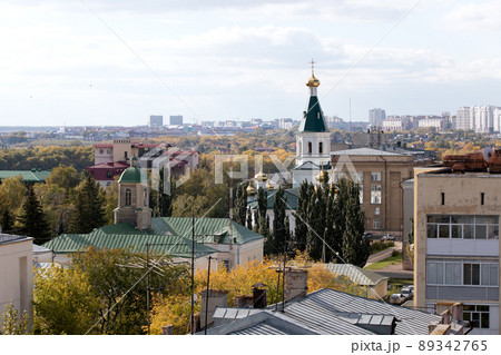 View of roofs of buildings in city with dome and cross of church View of roofs of buildings in city with dome and cross of church 89342765
