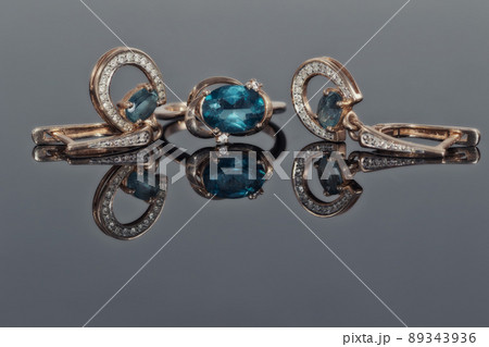 Gold earrings and ring with blue Topaz Gold earrings and ring with blue Topaz 89343936