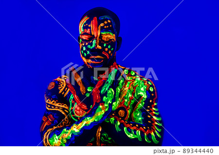 afro american man posing in studio shot with UV light afro american man posing in studio shot with UV light 89344440