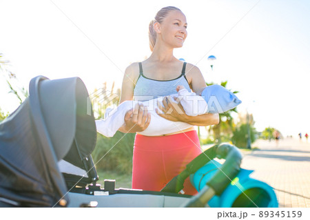 blonde beautiful woman ready to be the best mother and getting in shape after giving birth in tropics background beach blonde beautiful woman ready to be the best mother and getting in shape after giving birth in tropics background beach 89345159