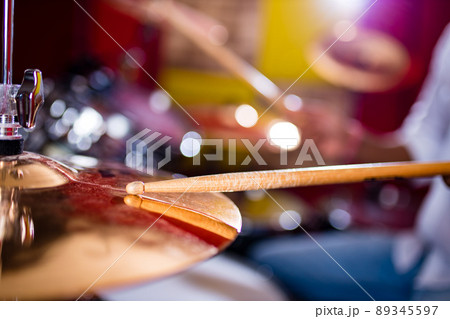 indian man playing the drums sticks close-up in recording studio indian man playing the drums sticks close-up in recording studio 89345597