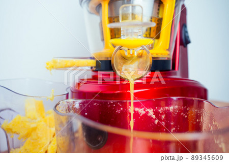 raw food diet concept oranges and juicemachine in white background raw food diet concept oranges and juicemachine in white background 89345609
