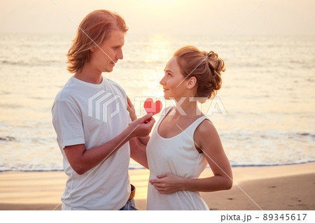 Justmarried couple running on a sandy beach Justmarried couple running on a sandy beach 89345617