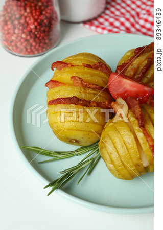 Concept of tasty food with baked potato on white background 89346439