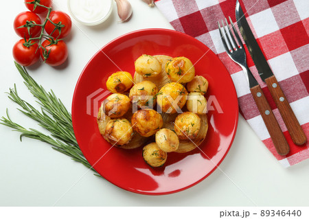 Concept of tasty food with baked potato on white background 89346440