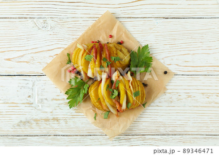 Tasty baked potato on white wooden table 89346471