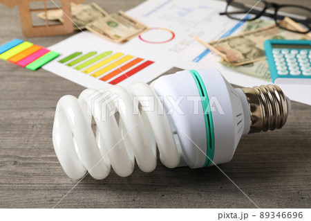 Energy saving concept on gray textured background Energy saving concept on gray textured background 89346696