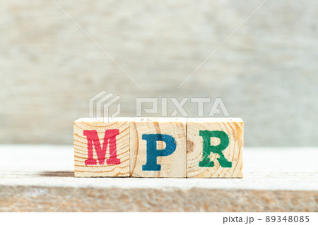 Alphabet letter block in word MPR (Abbreviation of Market price referent or Monthly progress report) on wood background 89348085