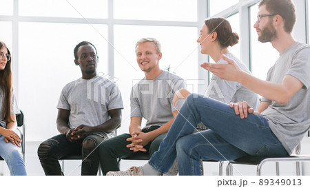 group of young like-minded people discussing their ideas group of young like-minded people discussing their ideas 89349013