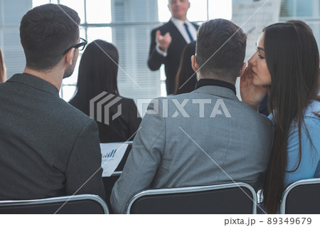employees discuss something during a business seminar employees discuss something during a business seminar 89349679