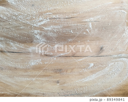 White flour on wooden table. Free space for text. 89349841