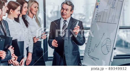 Head of business team explains to his colleagues the methods sa 89349932