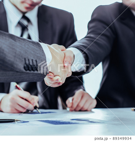 handshake of business partners on the background of a lawyer and 89349934