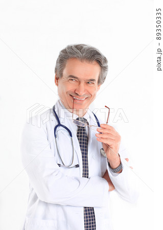 portrait of a benevolent physician therapist.isolated on white background portrait of a benevolent physician therapist.isolated on white background 89350335