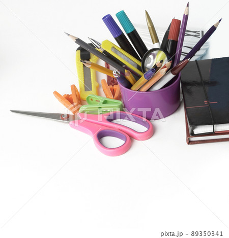 textbook, pen and school supplies isolated on white background textbook, pen and school supplies isolated on white background 89350341