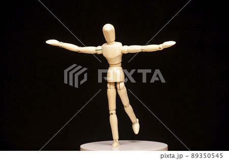 image of wooden figure dark background  89350545
