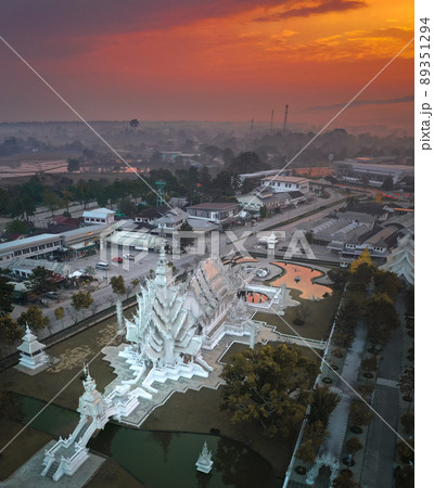 Aerial view of Wat Rong Khun, the white temple, at sunrise, in Chiang Rai, Thailand Aerial view of Wat Rong Khun, the white temple, at sunrise, in Chiang Rai, Thailand 89351294