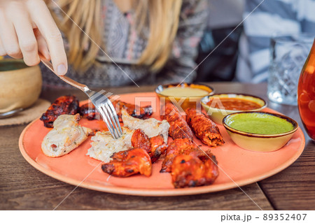Indian cuisine-Famous Indian mutton or lamb curry dish in a cast iron cookware. Selective focus photograph 89352407