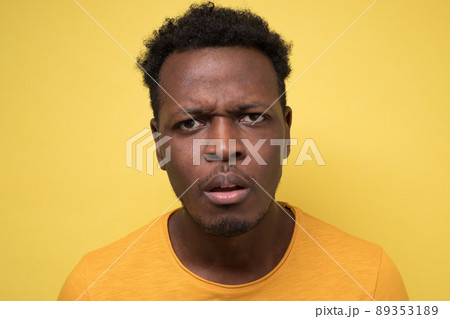 Young african man being skeptic and nervous, disapproving expression on fac Young african man being skeptic and nervous, disapproving expression on fac 89353189