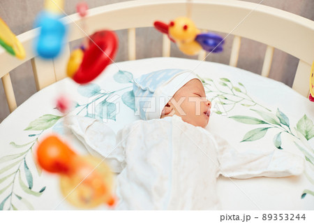 adorable new born baby sleeping in bed 89353244