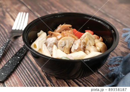homemade cooked chicken mushroom pasta in a bowl  89358187