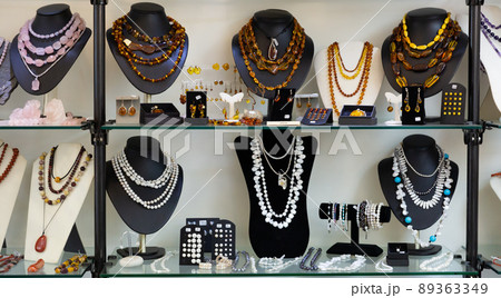 Semiprecious stone jewelry in glass case Semiprecious stone jewelry in glass case 89363349