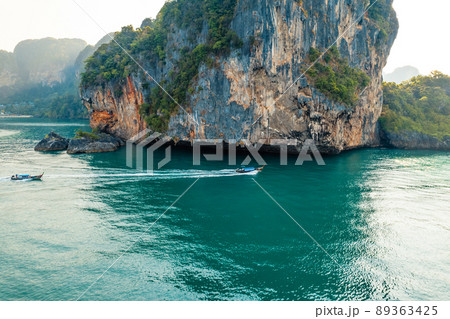 Sea views and rocky islands with a long-tail boat. 89363425