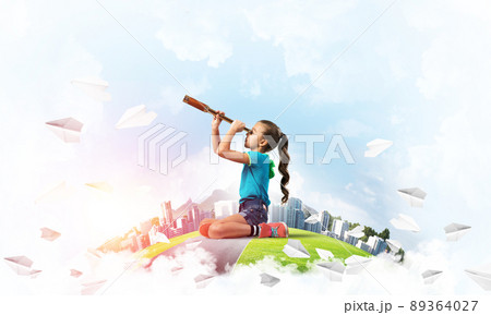 Concept of careless happy childhood with girl looking in future Concept of careless happy childhood with girl looking in future 89364027