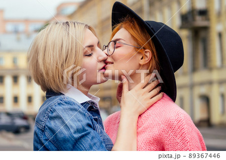 two cheerful same sex people in love walking outdoors in Europe two cheerful same sex people in love walking outdoors in Europe 89367446