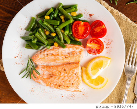 Fish salmon steamed with vegetables. Healthy diet food, dark wooden backdrop 89367747