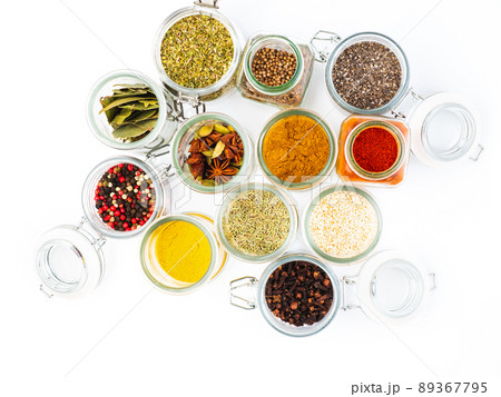 Set of spices in spoons top view. Paprika, curry, Bay leaf, anise and other seasonings Set of spices in spoons top view. Paprika, curry, Bay leaf, anise and other seasonings 89367795