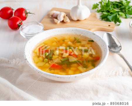 Healthy spring vegetable dietary vegetarian soup, white wooden background, side view, close up 89368016