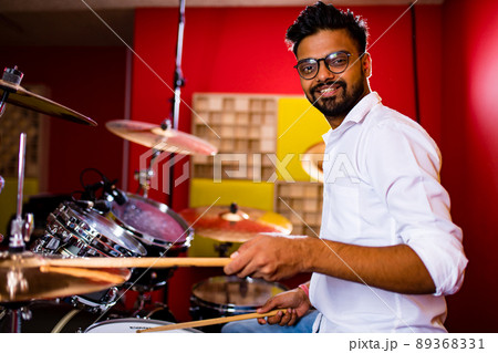 italian artist musician playing drumms during online concert at studio 89368331