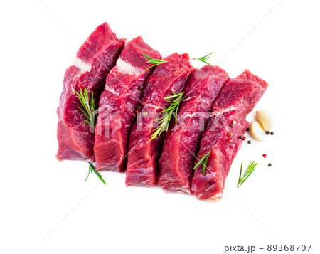 Raw meat, beef steak with seasoning on white background, top view Raw meat, beef steak with seasoning on white background, top view 89368707