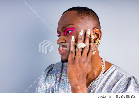 african american with pearl ring on the finger and necklace beads bijouterie on the neck wearing stylish shiny women dress with magnificent makeup 89368935