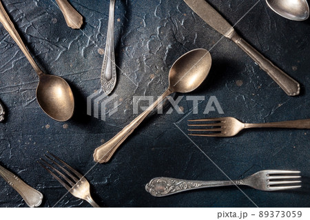 Cutlery pattern. Spoons, forks, and knives. Modern tableware on black Cutlery pattern. Spoons, forks, and knives. Modern tableware on black 89373059