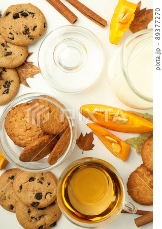 Concept of tasty food with pumpkin cookies on white background 89377270
