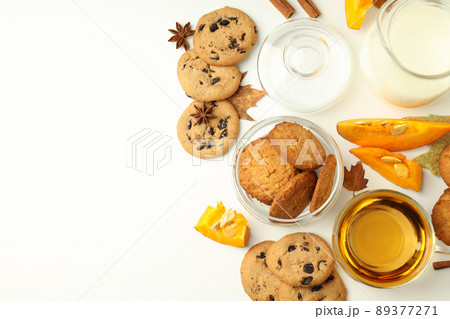 Concept of tasty food with pumpkin cookies on white background Concept of tasty food with pumpkin cookies on white background 89377271