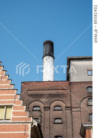MECHELEN, Malines, Antwerp, BELGIUM, March 2, 2022, Old facades, roofs and chimney of the beer 89381402