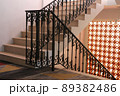 The vintage metal style, stair railing with orange bricks light wall 89382486