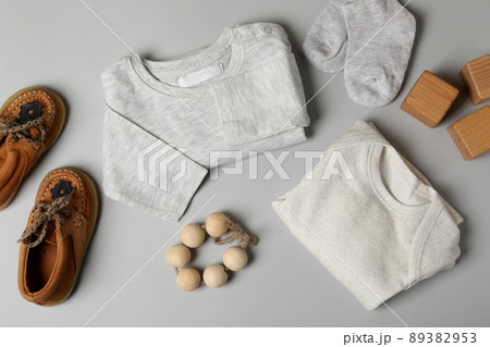 Concept of male baby clothes on light gray background Concept of male baby clothes on light gray background 89382953
