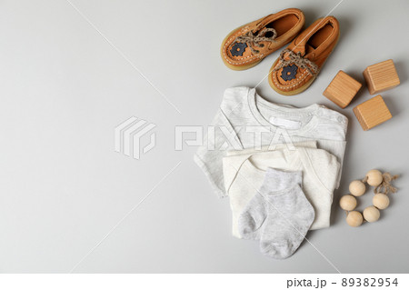 Concept of male baby clothes on light gray background 89382954