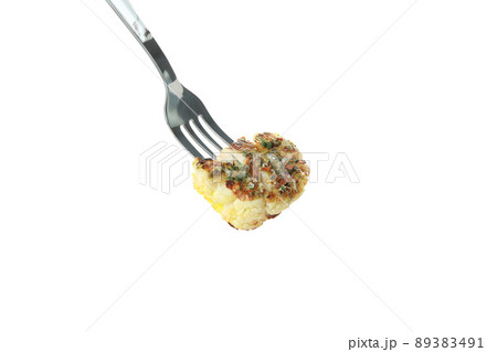 Fork with baked cauliflower isolated on white background Fork with baked cauliflower isolated on white background 89383491