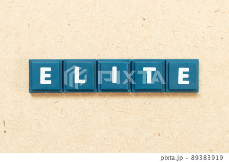 Tile alphabet letter in word elite on wood background 89383919