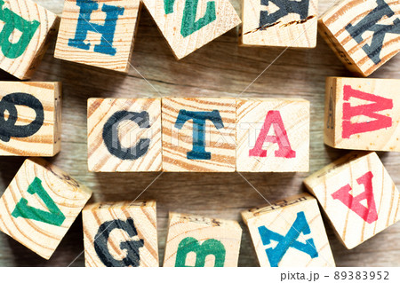 Alphabet letter block in word CTA (Abbreviation of Call to action or Chartered tax adviser) with another on wood background Alphabet letter block in word CTA (Abbreviation of Call to action or Chartered tax adviser) with another on wood background 89383952